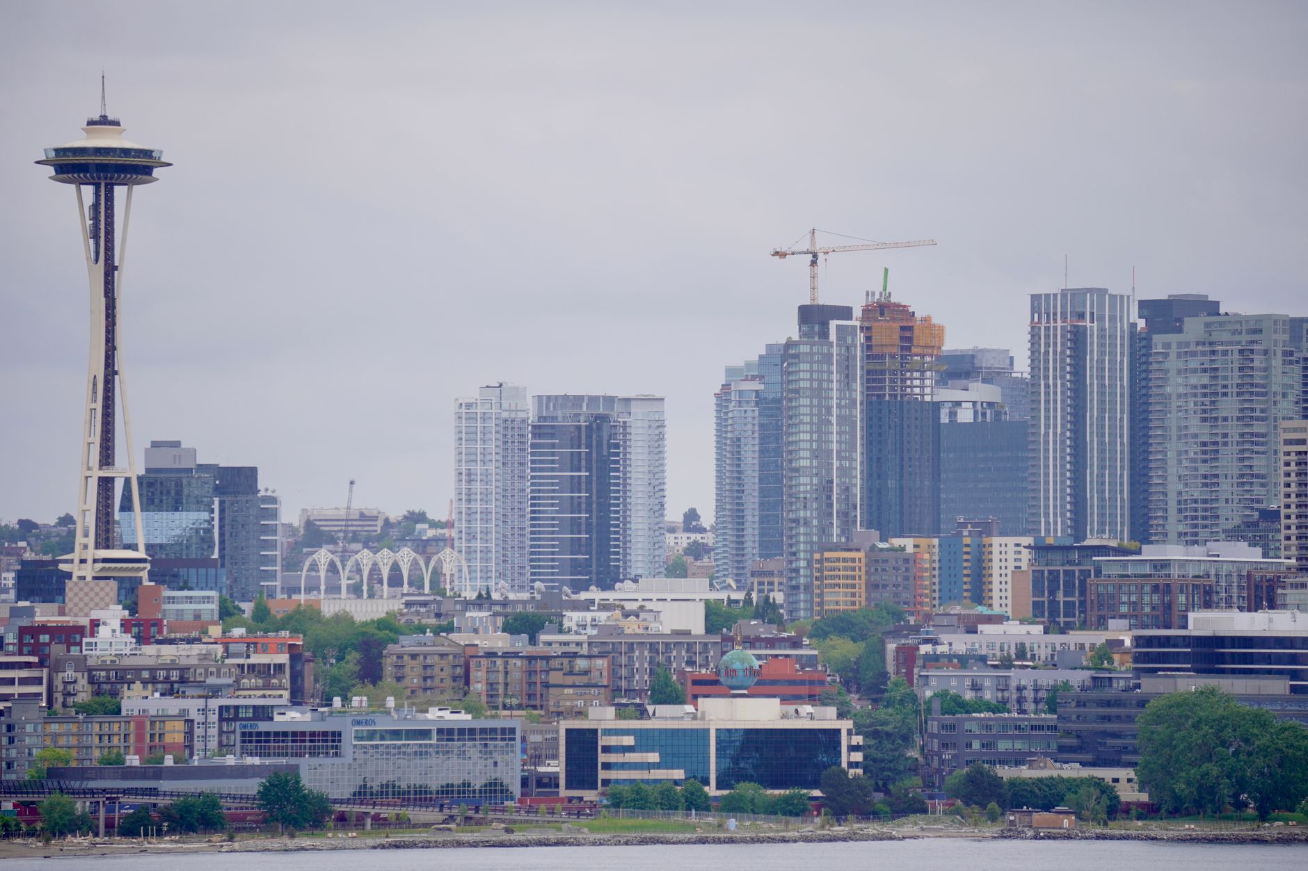 View of Seattle's iconic skyline with the Space Needle on a cloudy day.